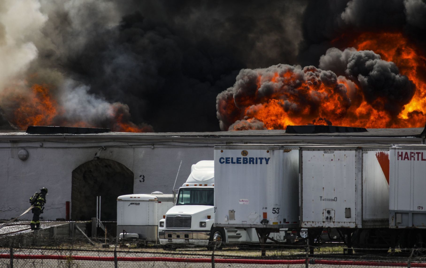 Large fire rolls through warehouse
